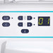 Control panel of a sewing machine with buttons and digital display.