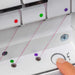 Close-up of a sewing machine needle threader with colored buttons and a finger pressing a button.