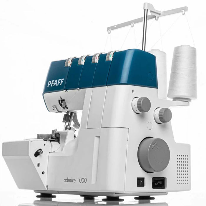 PFAFF sewing machine with blue top cover on a white background