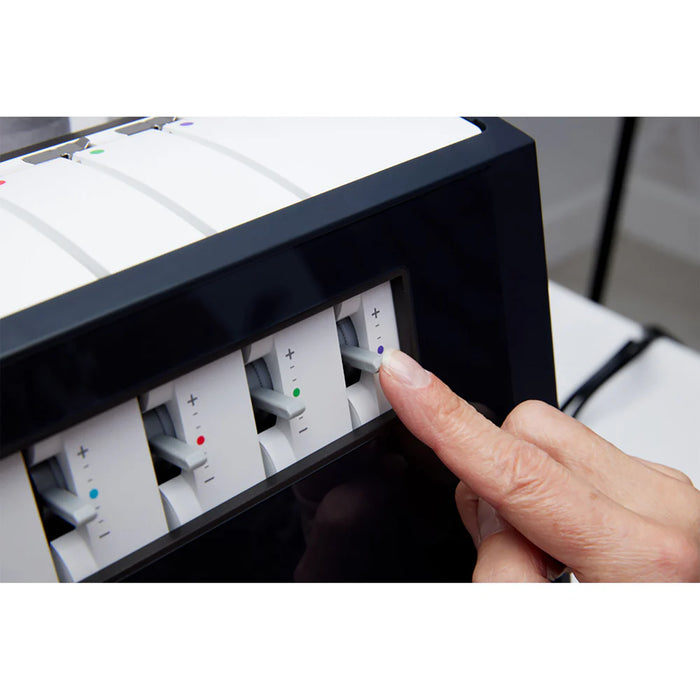 Person adjusting settings on a control panel with buttons and dials.