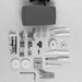 Collection of sewing machine parts and accessories on a gray background