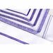 White fabric with blue zigzag stitching on a white background
