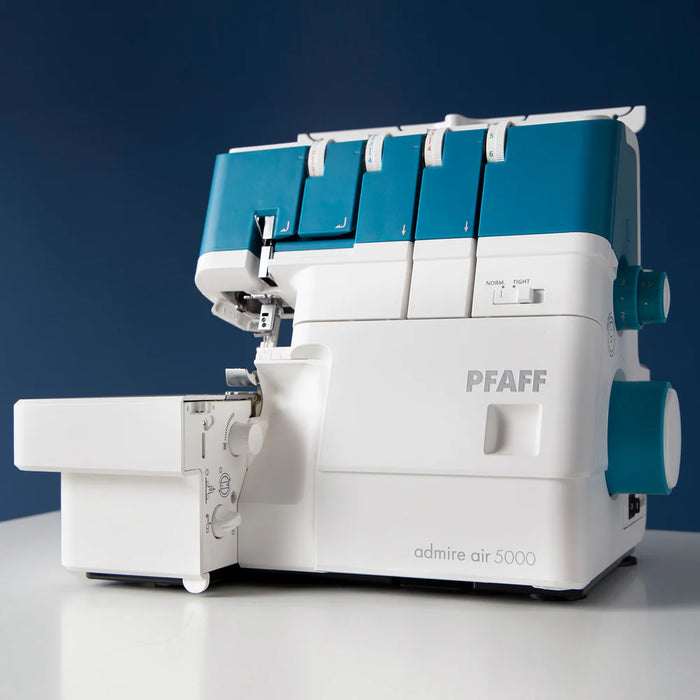 PFAFF admire air 5000 sewing machine on a white surface with a blue background
