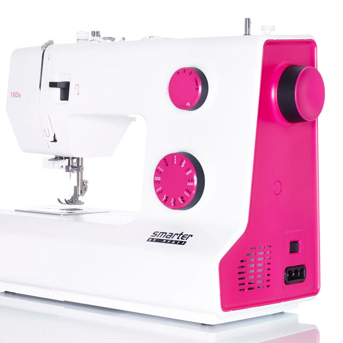 White sewing machine with pink accents on a white background