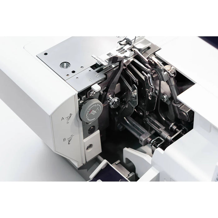 Close-up of a sewing machine's internal mechanism on a white background