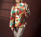 Person wearing a colorful checkered jacket against a dark background