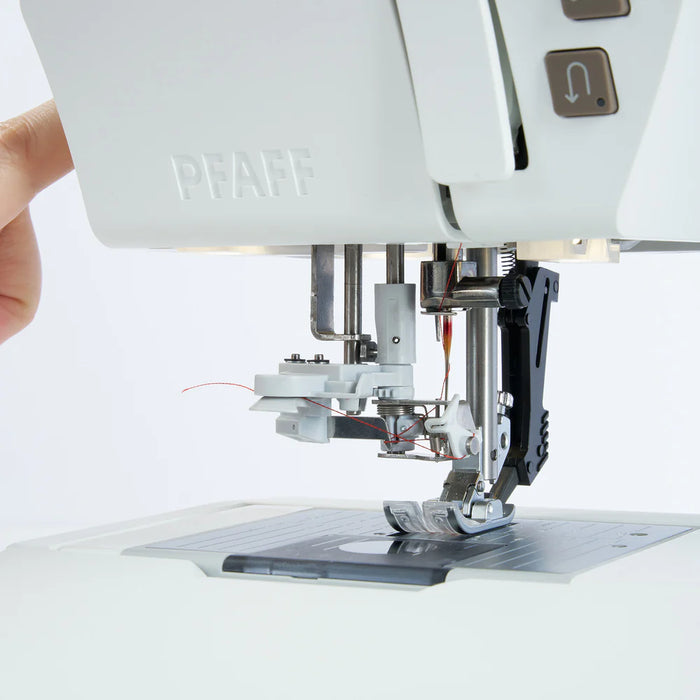Close-up of a sewing machine with a white background