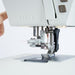 Close-up of a sewing machine with a white background