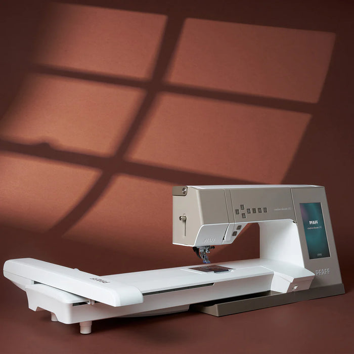 Sewing machine on a brown surface with a window-like shadow pattern