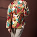Multicolored quilted jacket worn by a person on a dark background