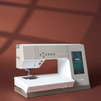 PFAFF sewing machine on a brown background