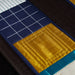 Close-up of a quilt with blue, yellow, and black colors.
