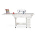 Arrow Alice 211 Sewing Cabinet in White fully extended with sewing machine, fold-out work surface, and storage drawers