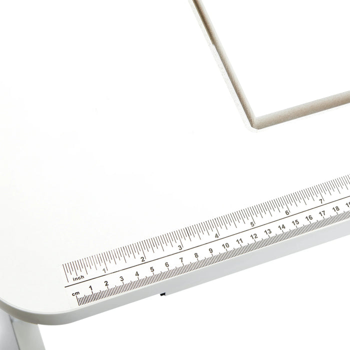 Close-up of the Arrow Gidget II Sewing Table 611 built-in ruler decal for accurate sewing measurements.