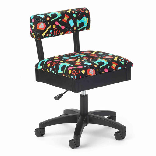 Arrow Black Notions Hydraulic Sewing Chair – front angle view with colorful sewing-themed upholstery, ergonomic padded backrest, and height-adjustable swivel base.