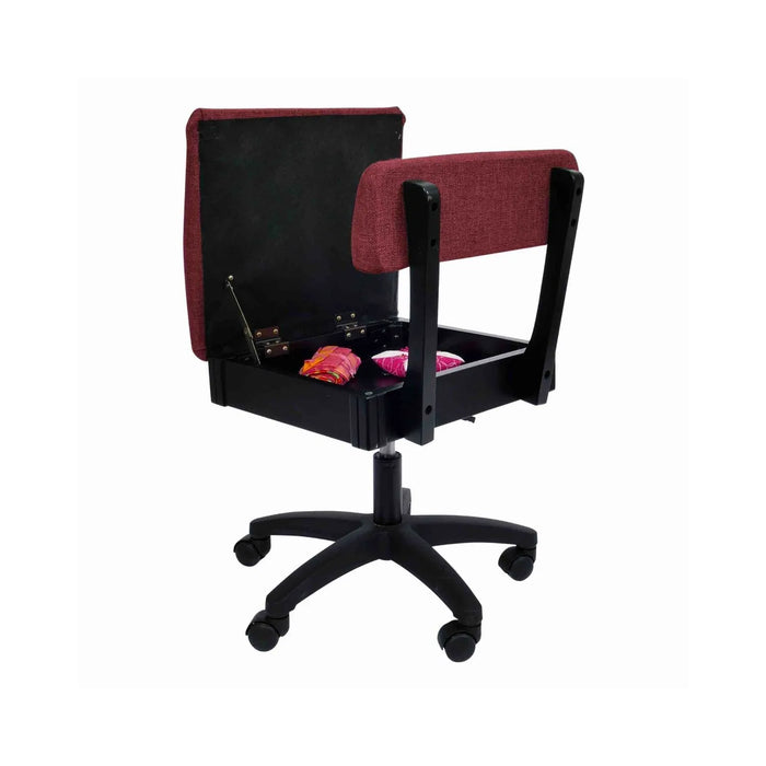 Arrow Madame Scarlet Hydraulic Sewing Chair – open seat storage compartment with sewing notions inside, featuring durable scarlet upholstery.