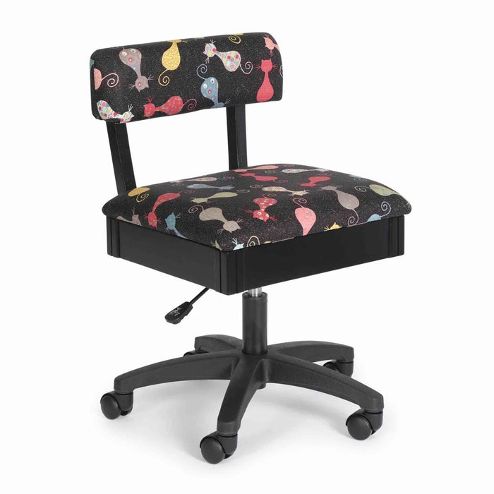 Arrow Cat’s Meow Hydraulic Sewing Chair Black – front angle view showing colorful cat-pattern upholstery, ergonomic backrest, and five-star swivel base.