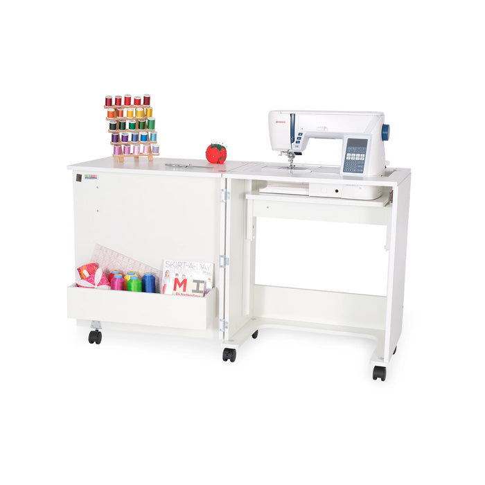 Arrow Judy 101 White Sewing Cabinet with machine installed, open workspace, and lower cubby storing fabric, thread, and sewing notions.