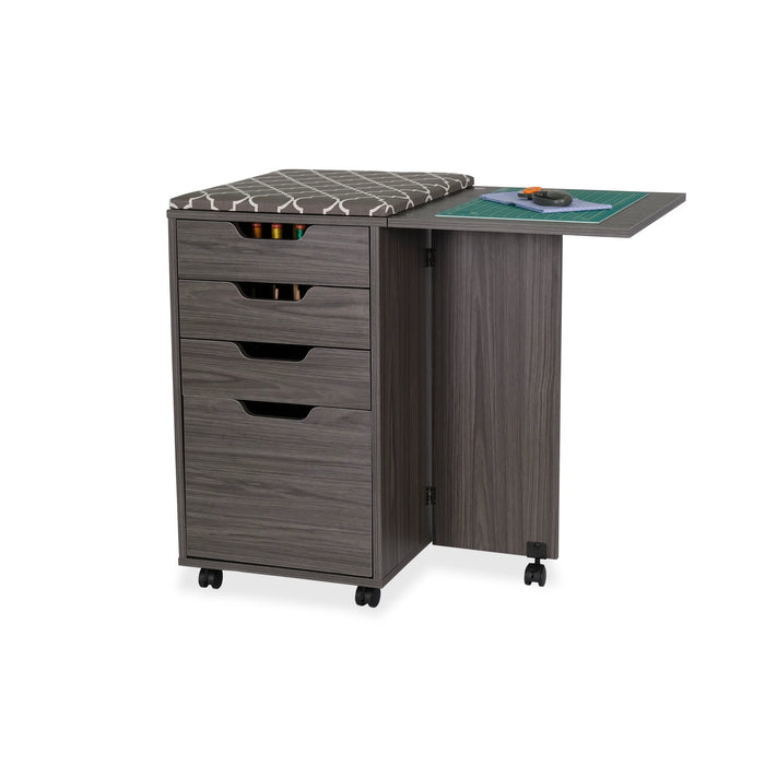Kangaroo Sewing Furniture Kiwi Storage Cabinet by Arrow Sewing in gray finish with closed drawers, ironing board topper, and fold-out cutting table on casters.
