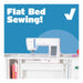 Flatbed sewing setup example demonstrating sewing machine positioned level on an Arrow sewing table surface.