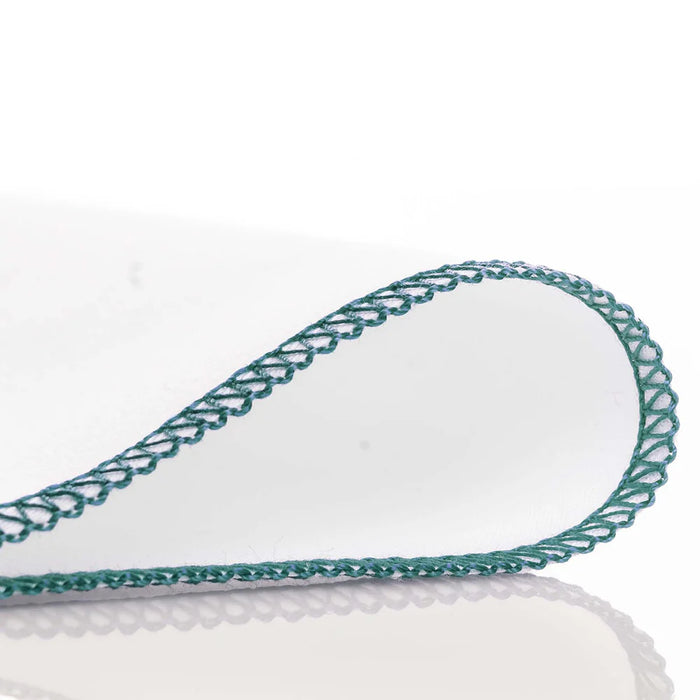 White towel with green lace trim on a white background