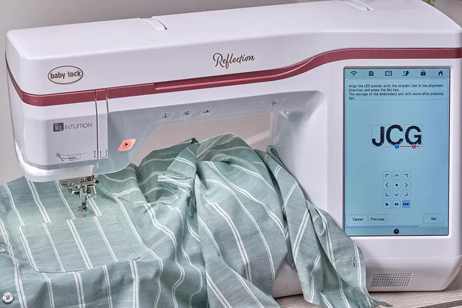 Baby Lock Reflection BLRT embroidery machine using 2-Point Positioning and Needle Beam for accurate monogram placement on fabric.