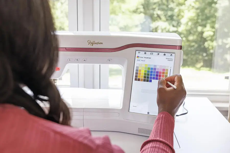 User adjusting thread colors on the Baby Lock BLRT Reflection embroidery machine’s 10.1-inch touchscreen with Color Visualizer tool.