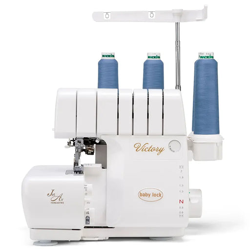 Baby Lock BLS3 Victory Serger front view with blue thread cones, Jet-Air Threading serger for professional sewing and finishing.
