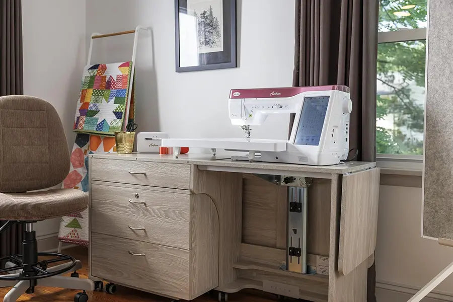 Baby Lock Anthem BLAN sewing machine set up in a home sewing studio on a lift sewing cabinet