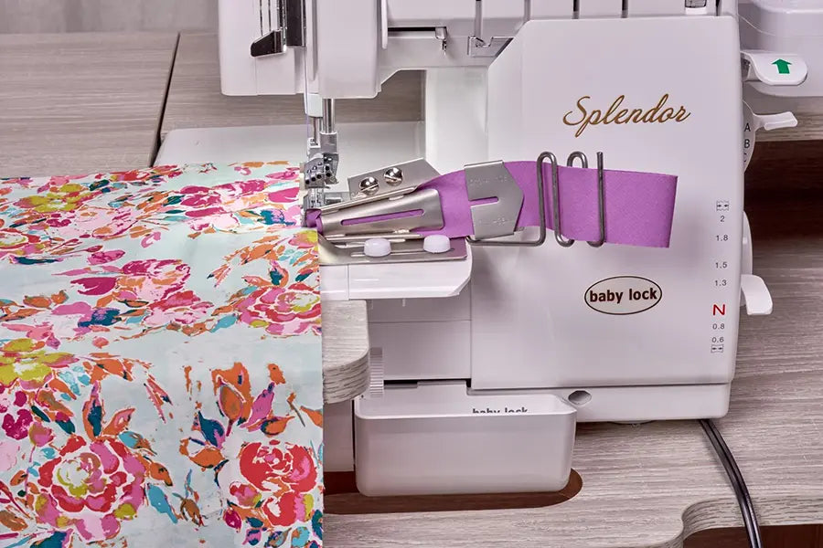 Baby Lock Splendor BLSP8 serger using bias binder attachment with colorful fabric