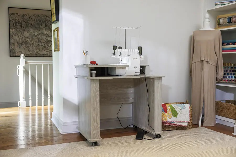 Baby Lock BLSP8 Splendor serger set up in sewing studio on a serger workstation table