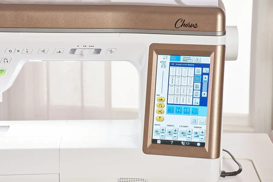 Close-up of Baby Lock Chorus quilt and sewing machine touchscreen displaying built-in stitches and digital settings