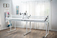 Baby Lock Gallant BLGT15 long arm quilting setup displayed in sewing room with natural lighting and quilting tools.
