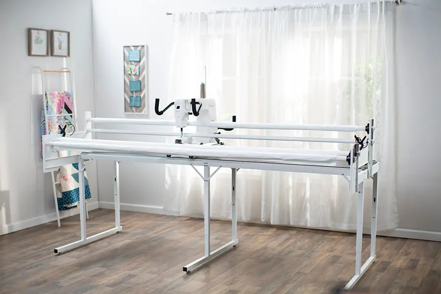 Baby Lock Gallant BLGT15 long arm quilting setup displayed in sewing room with natural lighting and quilting tools.