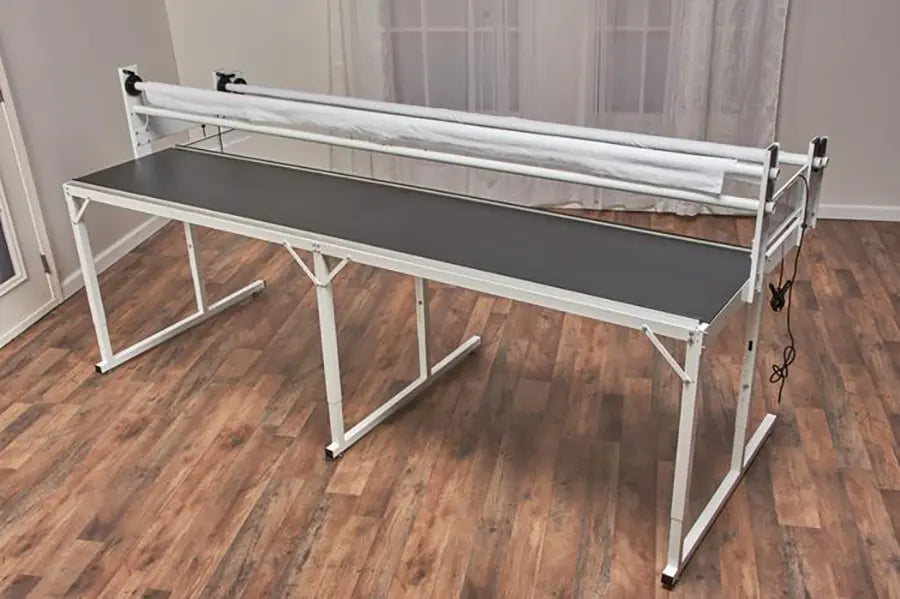 Baby Lock 8-foot Villa quilting frame with adjustable height shown without machine for long arm quilting setups.