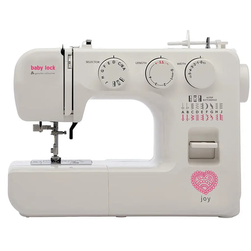 Baby Lock Joy BL25B sewing machine front view showing stitch selector dials, needle area, and pink decorative heart logo.