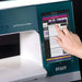 PFAFF sewing machine with a hand interacting with the touchscreen interface