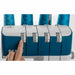 Blue and gray sewing machine with spools of blue thread on a white background