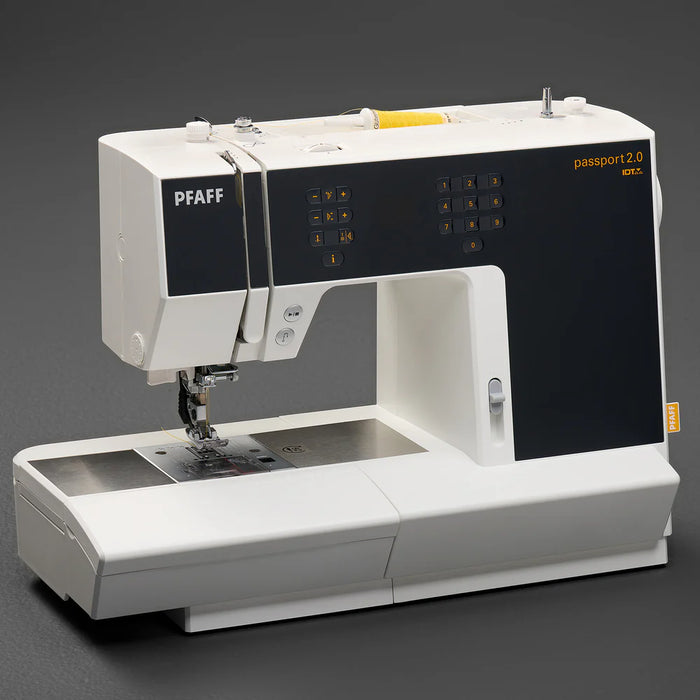PFAFF sewing machine on a dark background