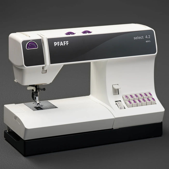PFAFF sewing machine on a dark background