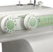 Close-up of Janome 2212 stitch selector and length control dials with built-in stitch guide.
