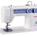 Janome 712T manual treadle sewing machine close-up displaying stitch options, tension controls, and durable flatbed construction.