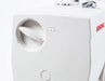 Detailed side view of the Janome Sewist 725S showing tension adjustment knob and Janome branding.