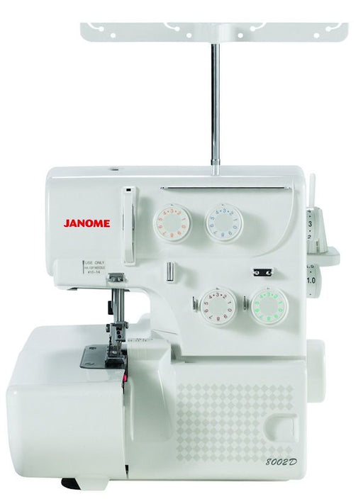 Janome 8002D Serger Machine front view showing thread tension dials, stitch controls, and upper thread stand for professional overlock stitching.