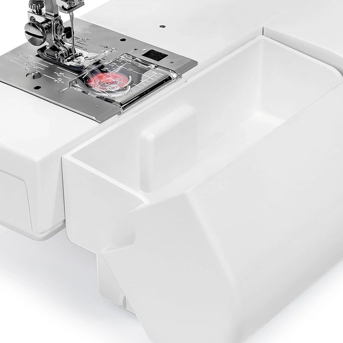 Janome HD-3000 free arm and storage compartment open, showing accessible space for sewing accessories and tools.