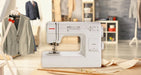 Janome HD-3000 Mechanical Sewing Machine displayed in a professional sewing studio setting, ideal for beginners and advanced sewists.