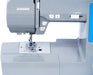 Close-up of Janome Loft 100 sewing machine needle area and metal needle plate for precision stitching