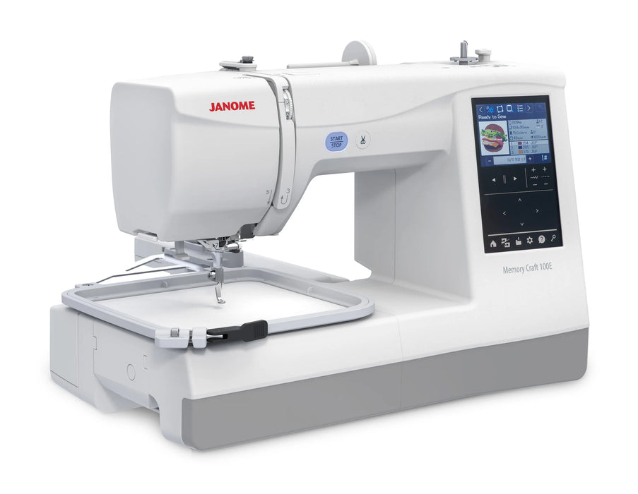 Janome Memory Craft 100E embroidery machine angled view with attached embroidery hoop and full-color LCD screen for design selection.