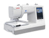 Janome Memory Craft 100E embroidery machine angled view with attached embroidery hoop and full-color LCD screen for design selection.