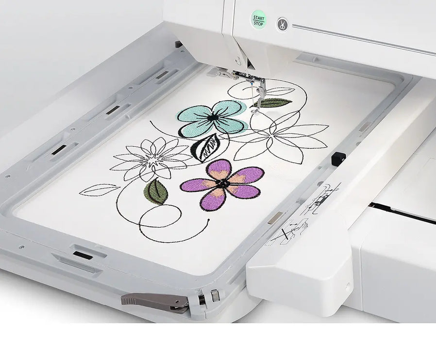 Janome MC550E Limited Edition embroidery machine stitching multicolor floral pattern in large hoop frame.